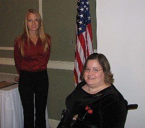 In observance of National Disability Employment Awareness month, Janel Nelson (l), chapter vice president for diversity, helps recognize Katie Hoak, a missile defense analyst at the U.S. Strategic Command.